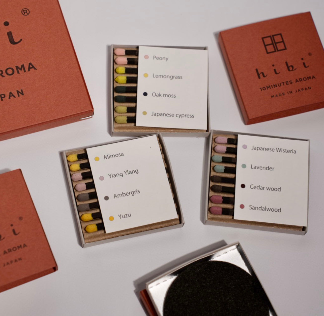 Hibi incense boxes with names of different scents on a white background