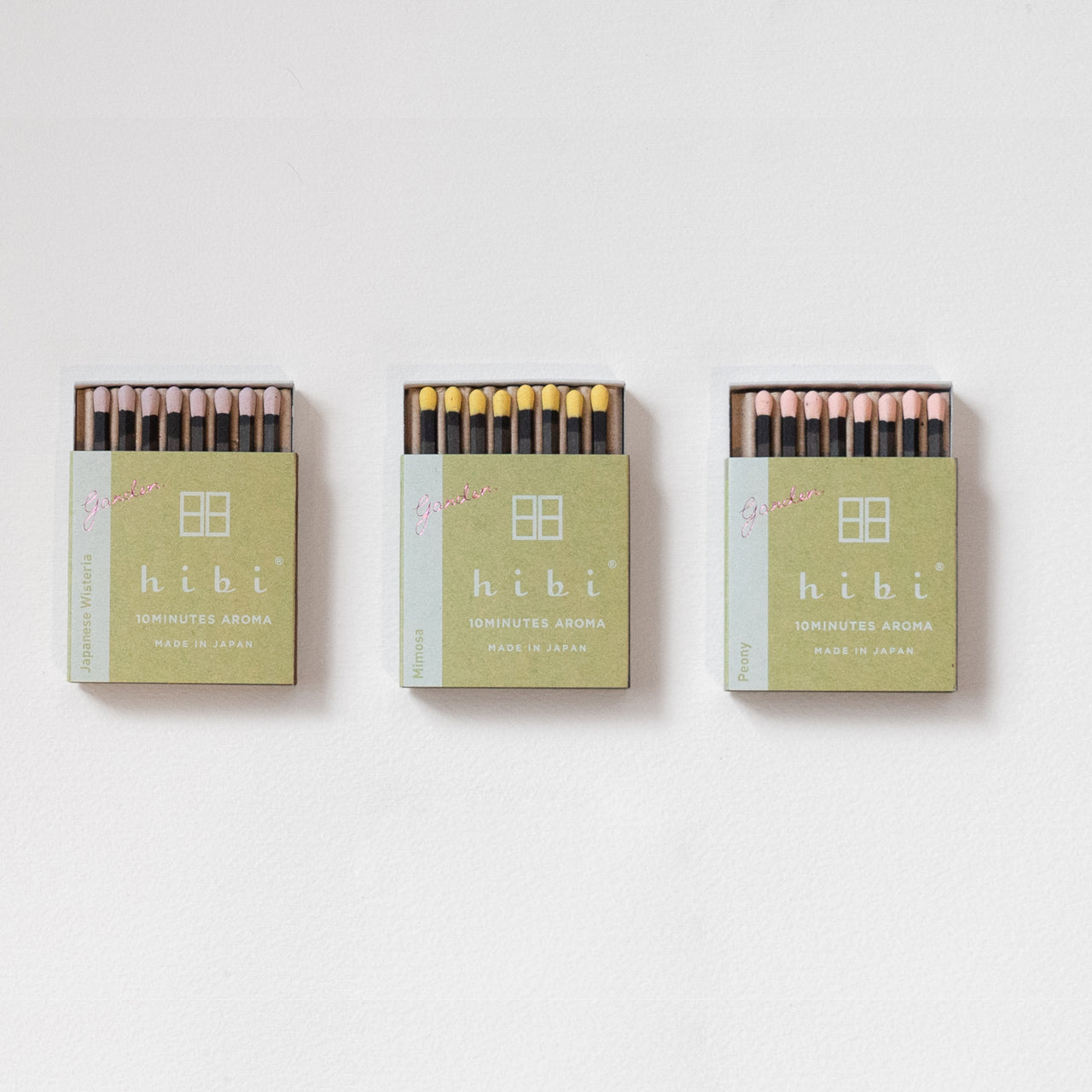 Three opened boxes of Hibi 10 Minutes Aroma - Mimosa, Japanese Wisteria and Peony, set against a white background.
