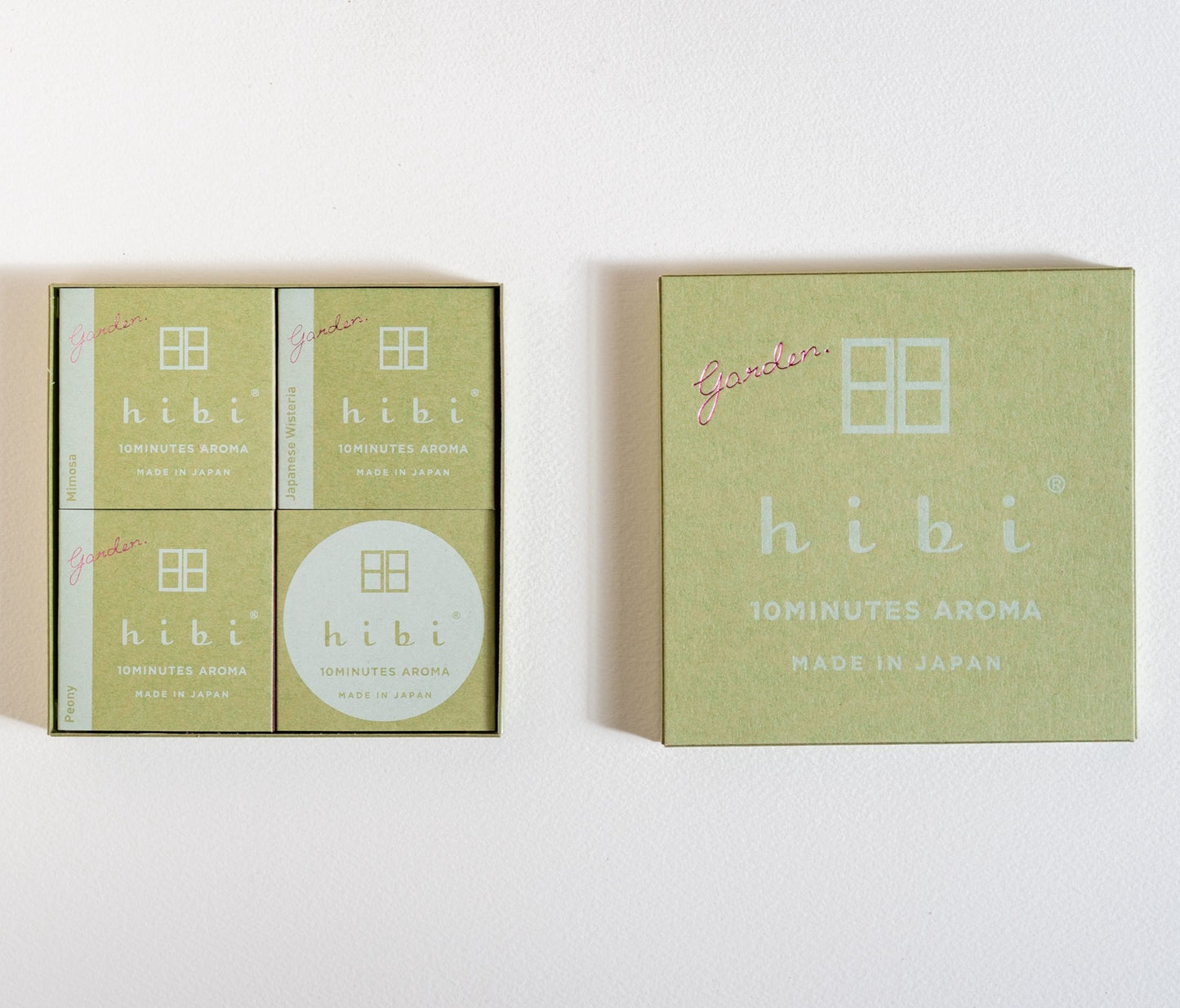 A opened Hibi 10 Minutes Aroma gift box containing three packs of Mimosa, Japanese Wisteria and Peony incense matches, and a non-flammable mat with a white background